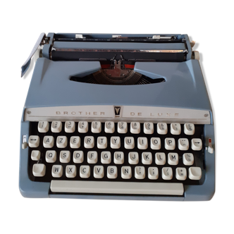 Vintage Brother de Luxe typewriter and its cover