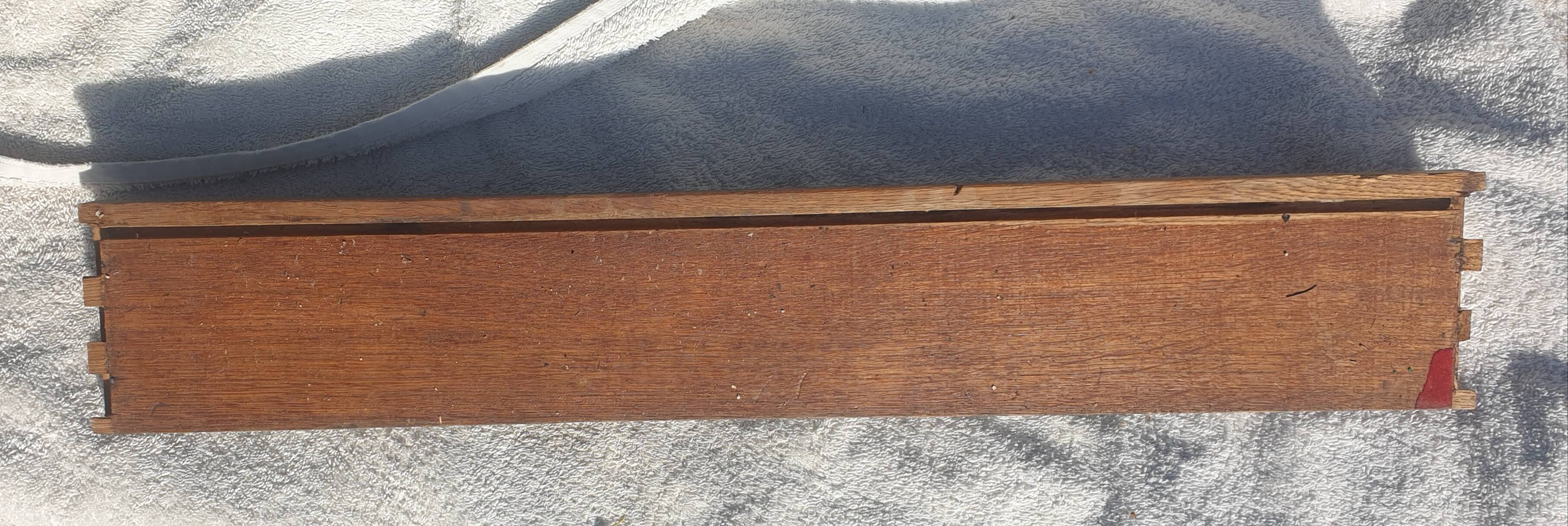 Carved wooden pediment with bunches of grapes