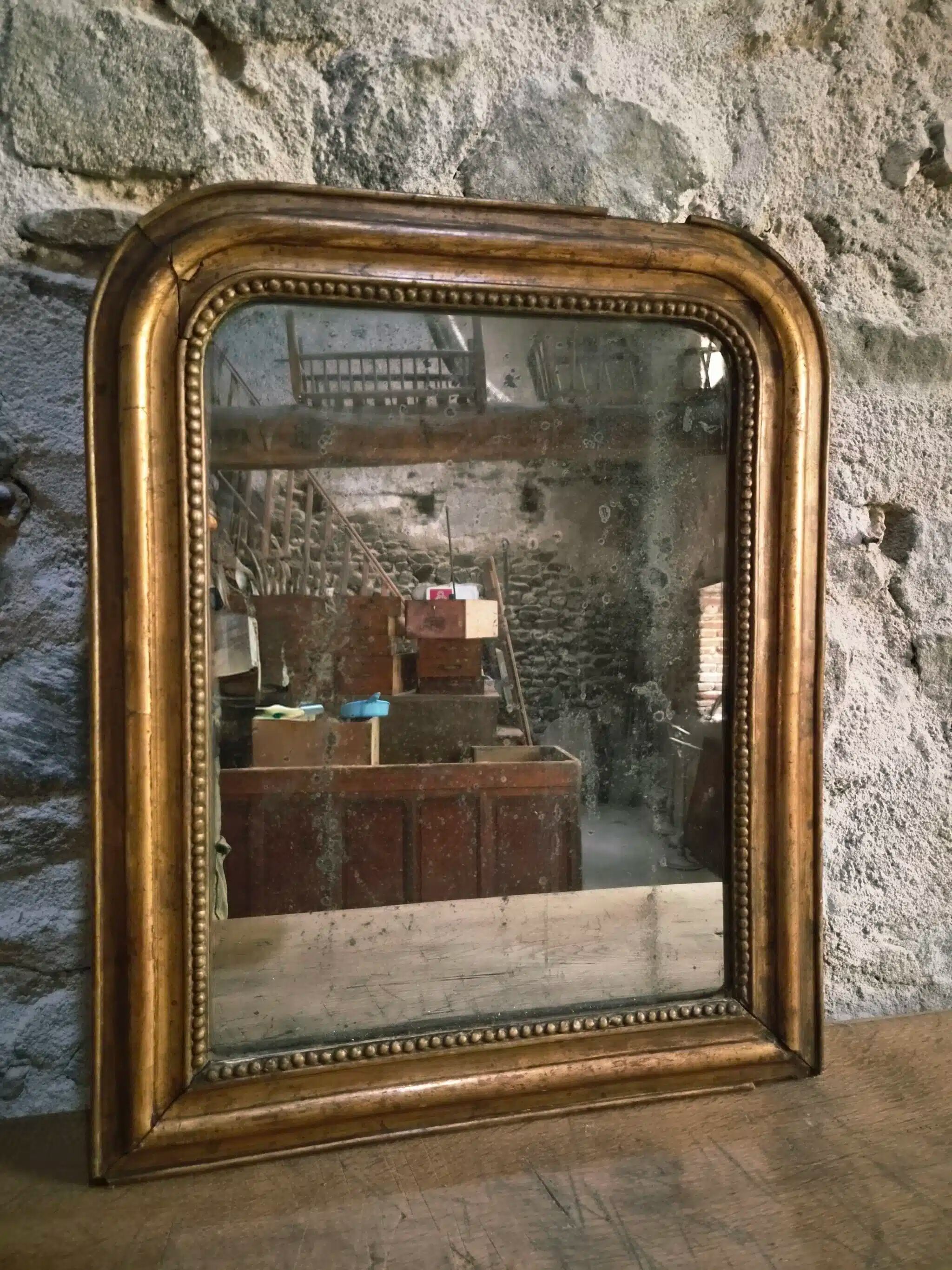 Antique French Louis Philippe mirror, gilded mercury mirror, 19th century.