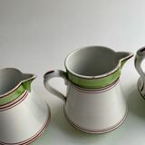 Series of 4 small pitchers.