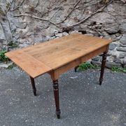 Vintage pine table with drop-leaf extension and turned beech legs, France, 1930s.