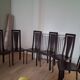 Set of 6 wooden chairs covered in leather.
