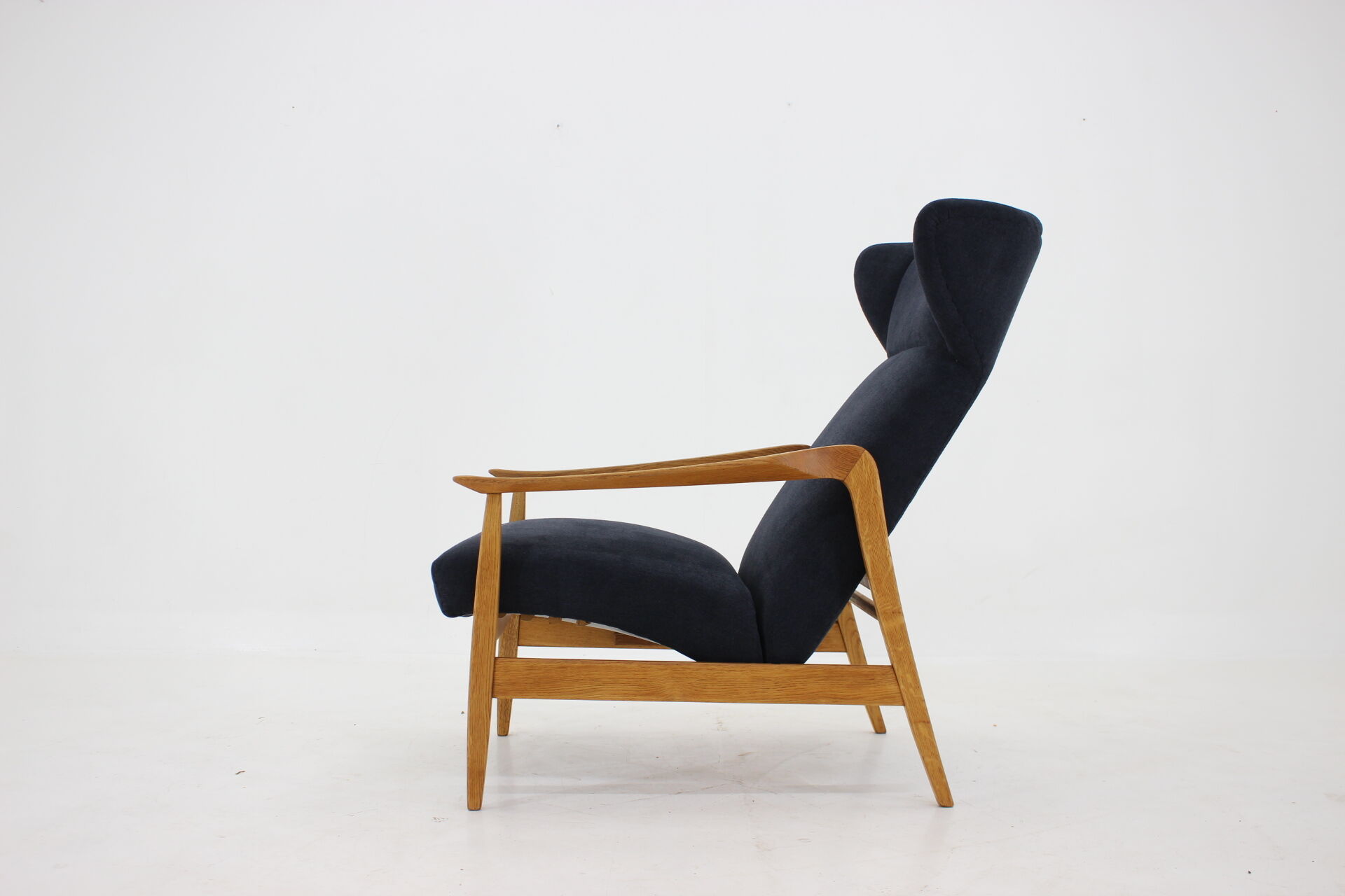 Oak reclining wing chair, czechoslovakia, 1960