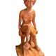 Painted plaster sculpture of a nude woman on a bench