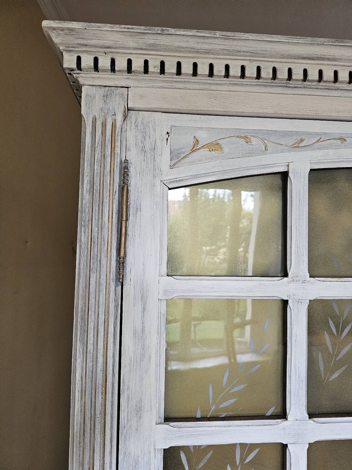 Antique bookcase with a white cerused patina