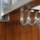 Modernist wall-mounted cloakroom in teak