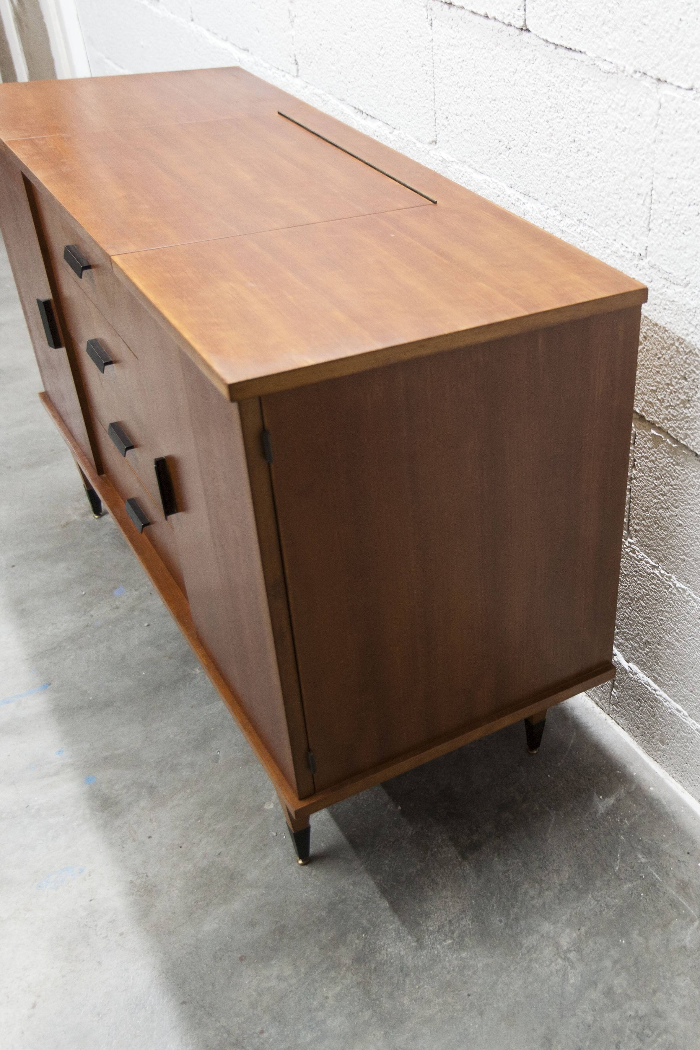 1960s teak sideboard with 4 drawers, 2 doors, and a mirror.