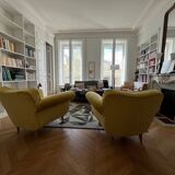 A pair of 1920s armchairs with an ottoman. Good condition.