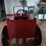 Vintage red pedal car