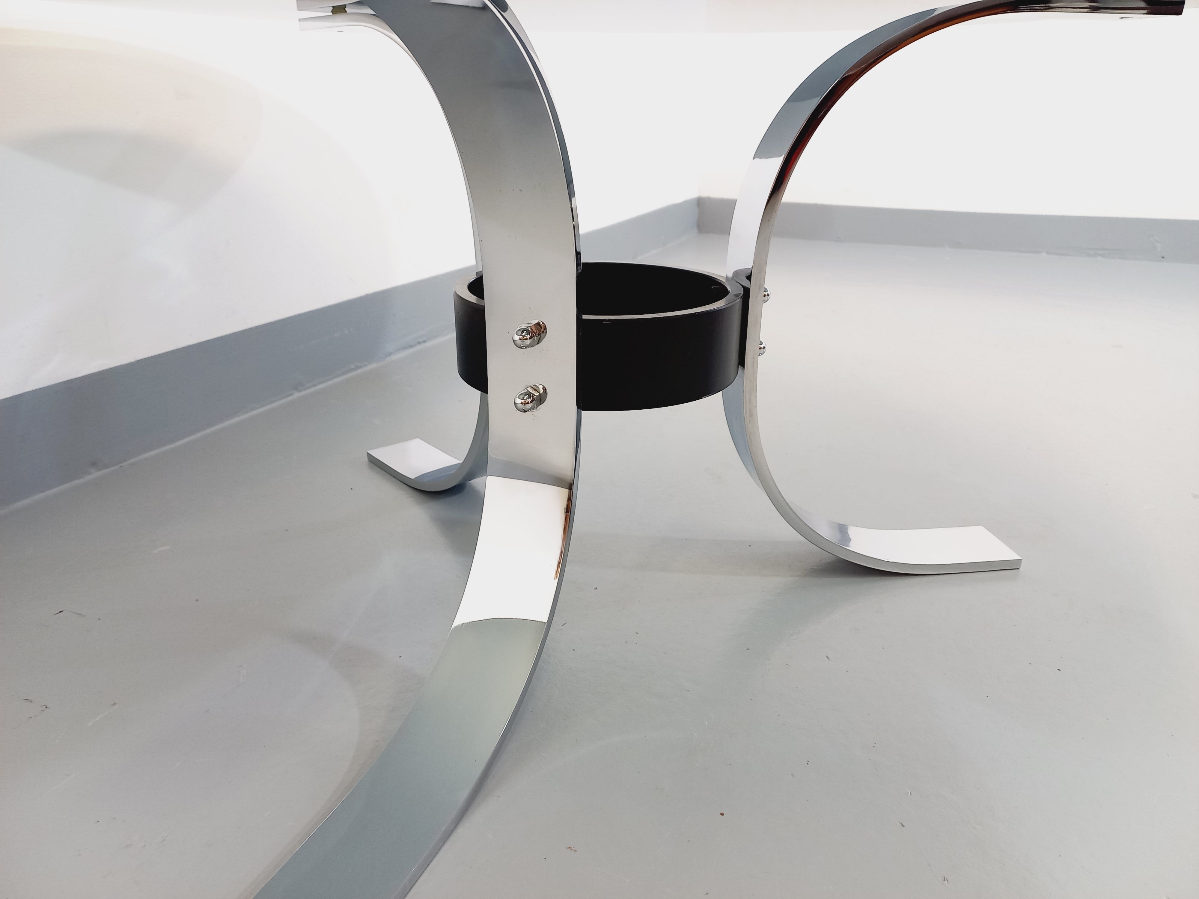 Vintage round coffee table in glass, chromed metal and black metal Space Age style of the 70s