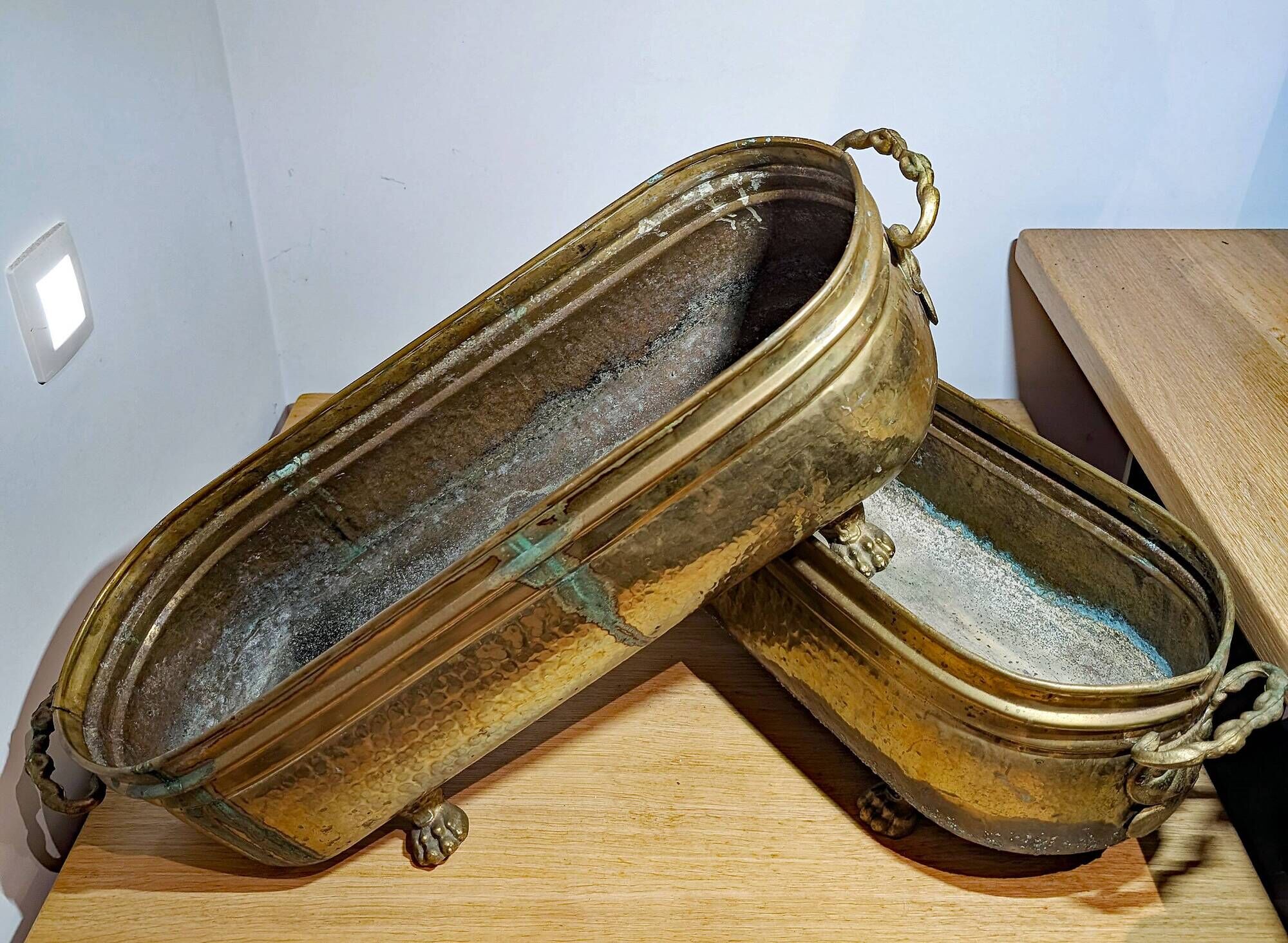 Pair of large antique planters with lion's paw feet.