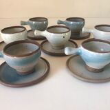 Lot 7 cups and saucers sandstone by Roger Jacques