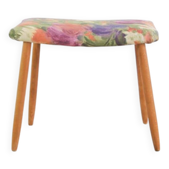 Footstool with flowered fabric