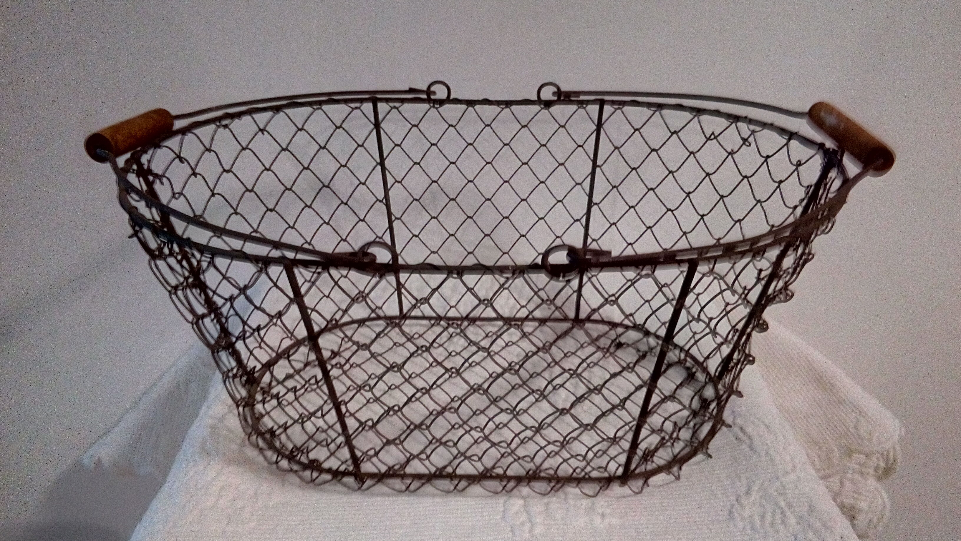 Duo of aged metal mesh baskets