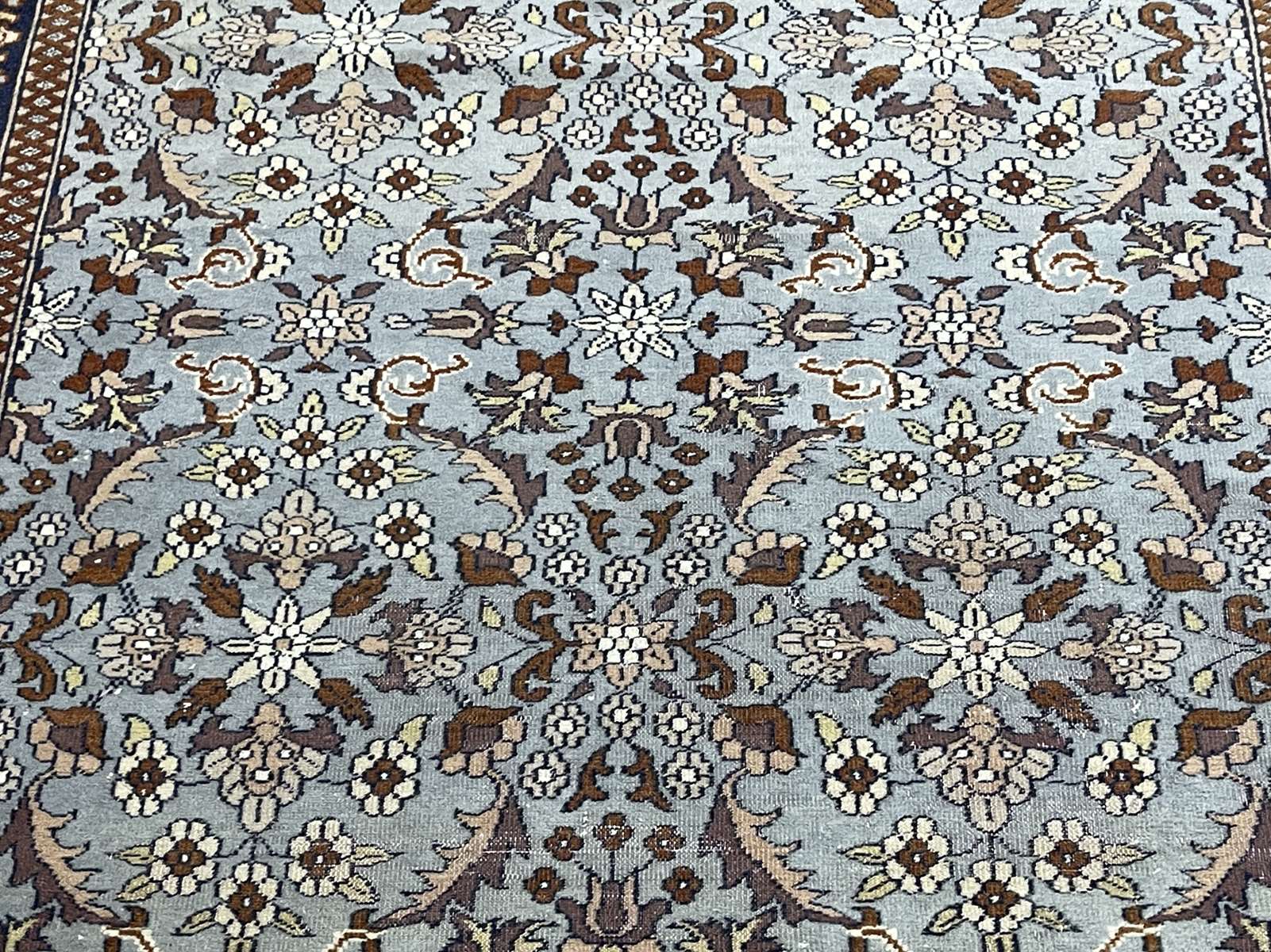 Handmade wool oriental carpet (wear defects)