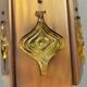 Older hanging lamp, made of metal with yellow prisms.