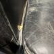 Pair of leather armchairs with marquetry armrests