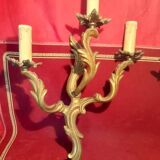 Pair of rococo style gilded bronze sconces with 3 light arms
