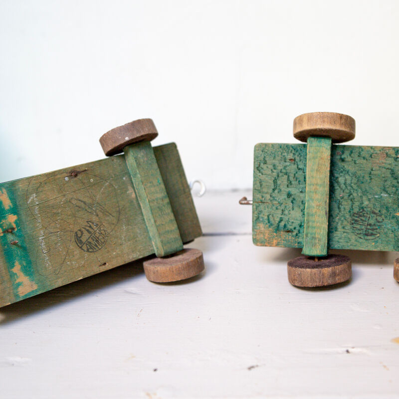 Old wooden train locomotive and toy trailer