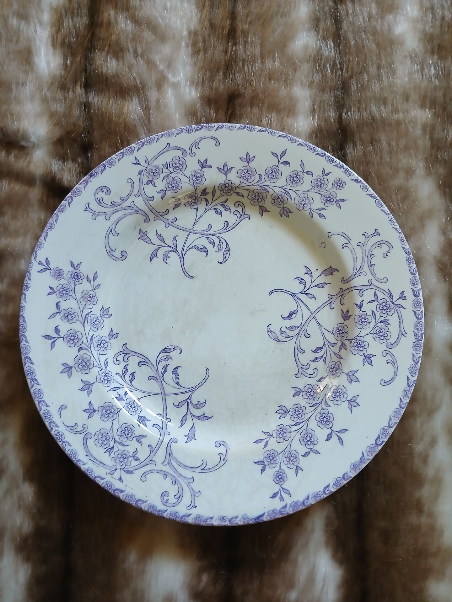 13 mismatched flat plates in ironstone