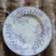13 mismatched flat plates in ironstone