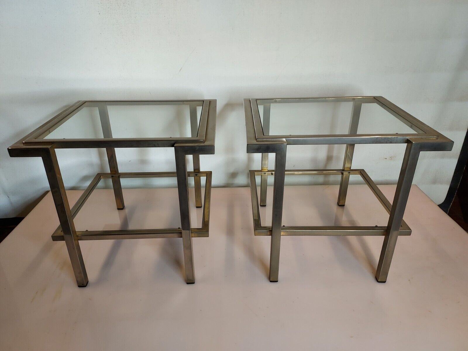 Pair of end of sofas in brushed iron signed Guy Lefevre