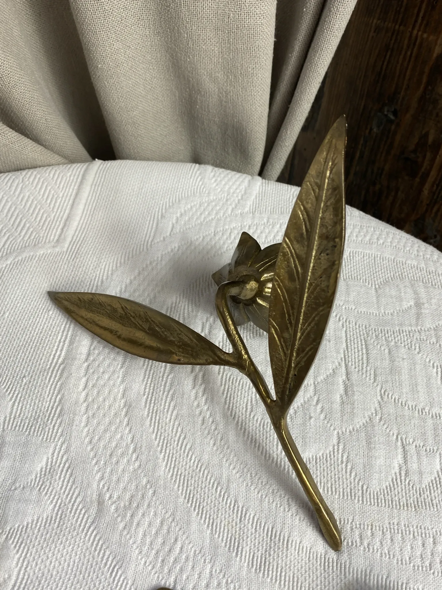 Flower candlestick and removable ashtrays in solid brass.
