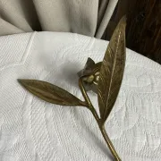 Flower candlestick and removable ashtrays in solid brass.