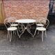 Wrought iron garden furniture chairs and table