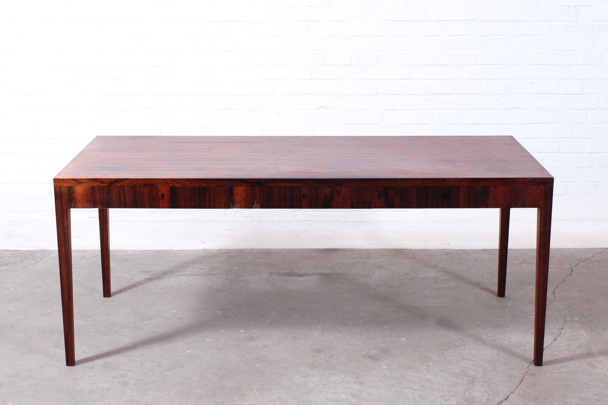 Minimalist rosewood desk by Riis Andersen