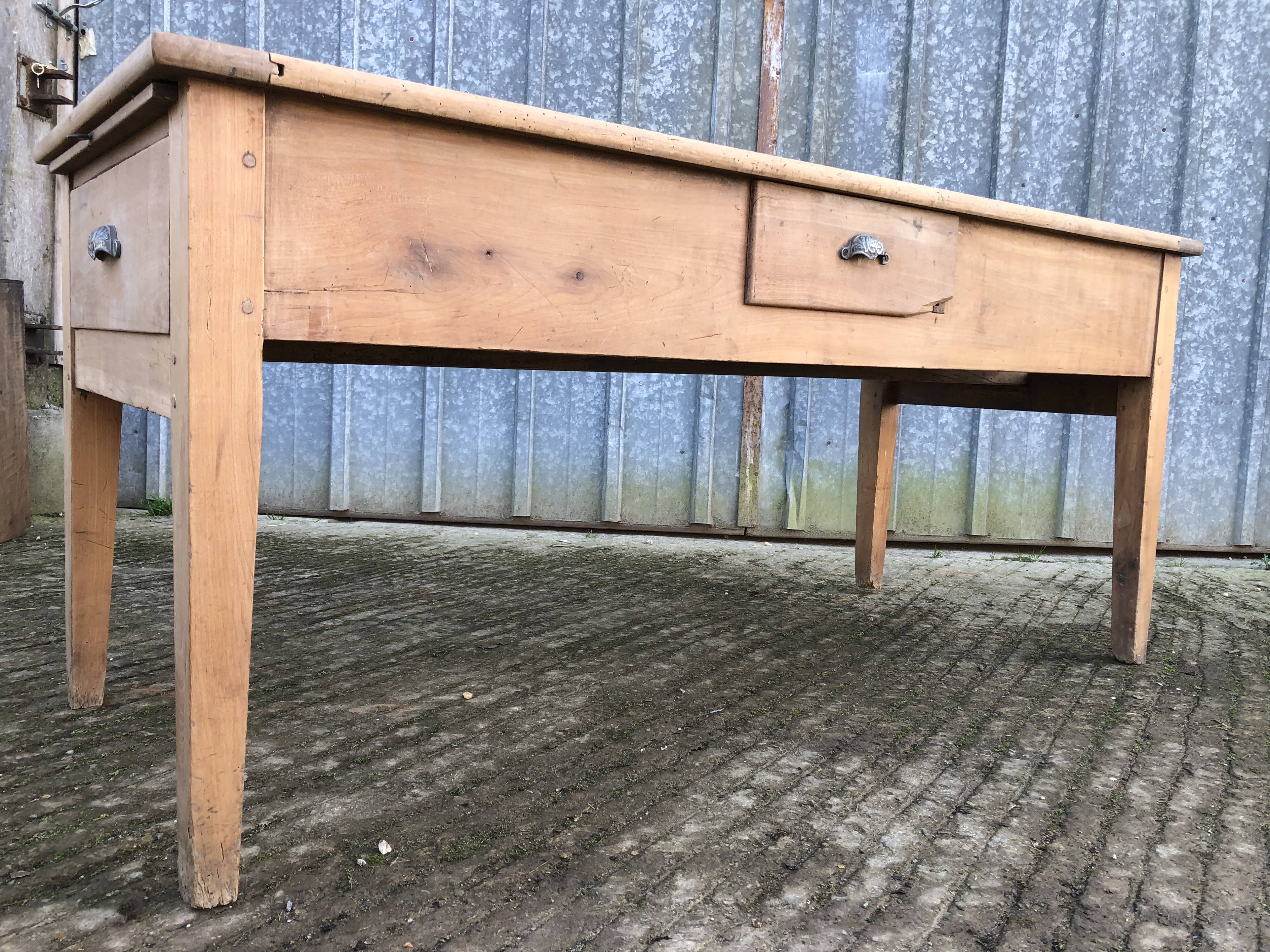 Antique solid cherry farmhouse table with 3 drawers and 1 pull out.