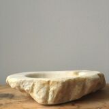 White marble ashtray with a raw appearance