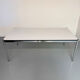 Large table design USM Haller with a white top and chrome structure.
