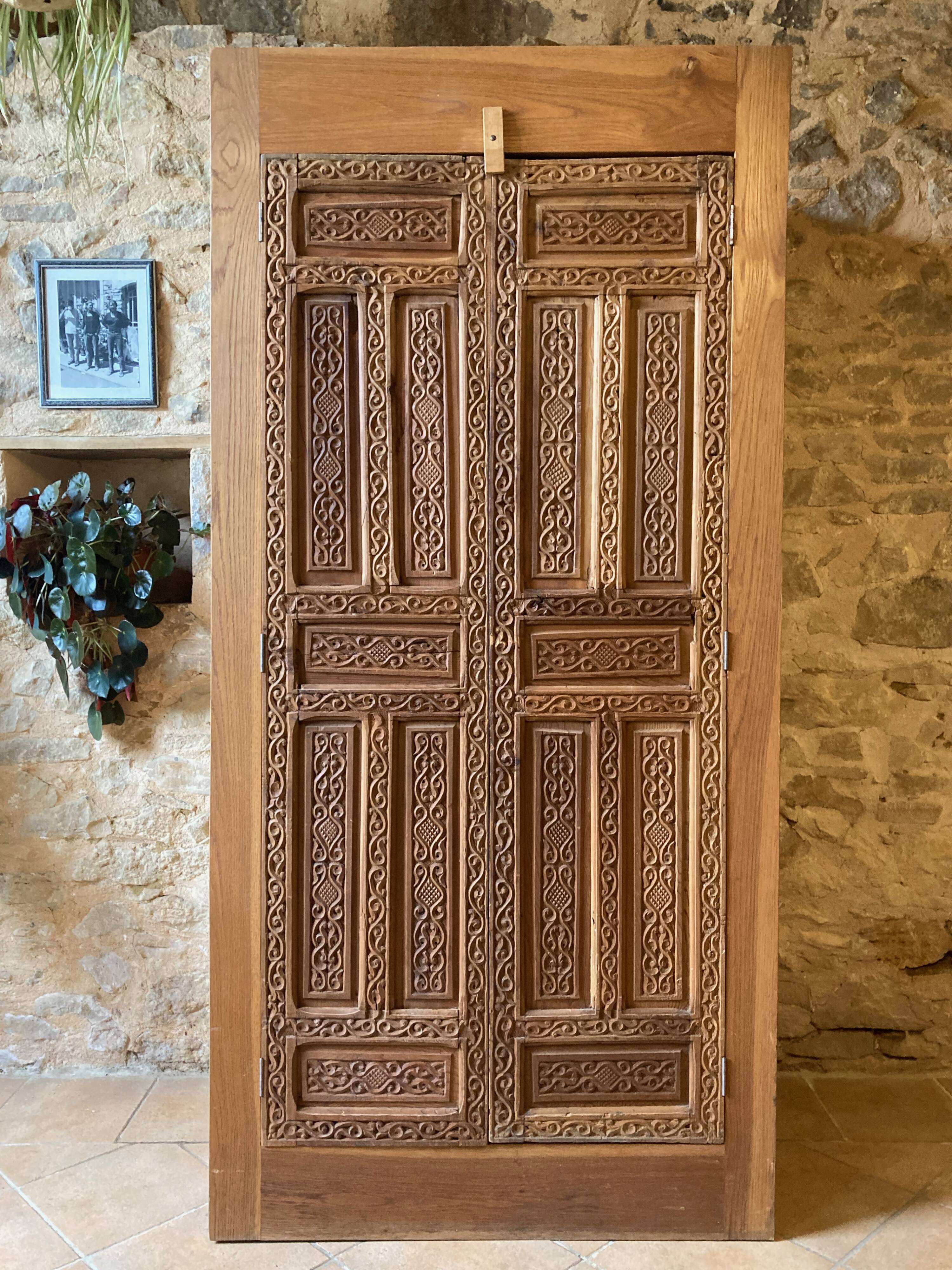 Wardrobe with exotic carved doors