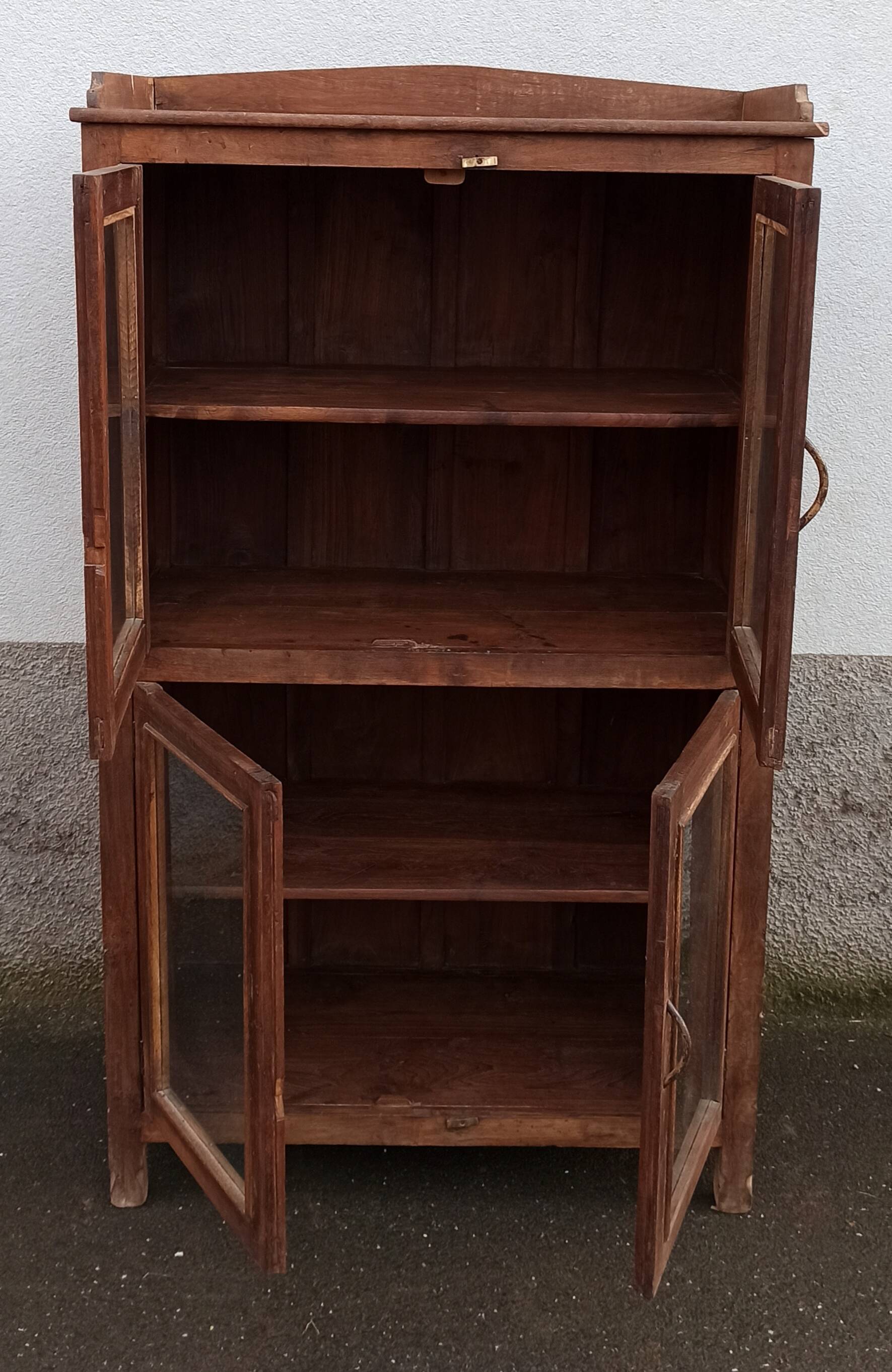 Old wooden glazed cabinet with four doors