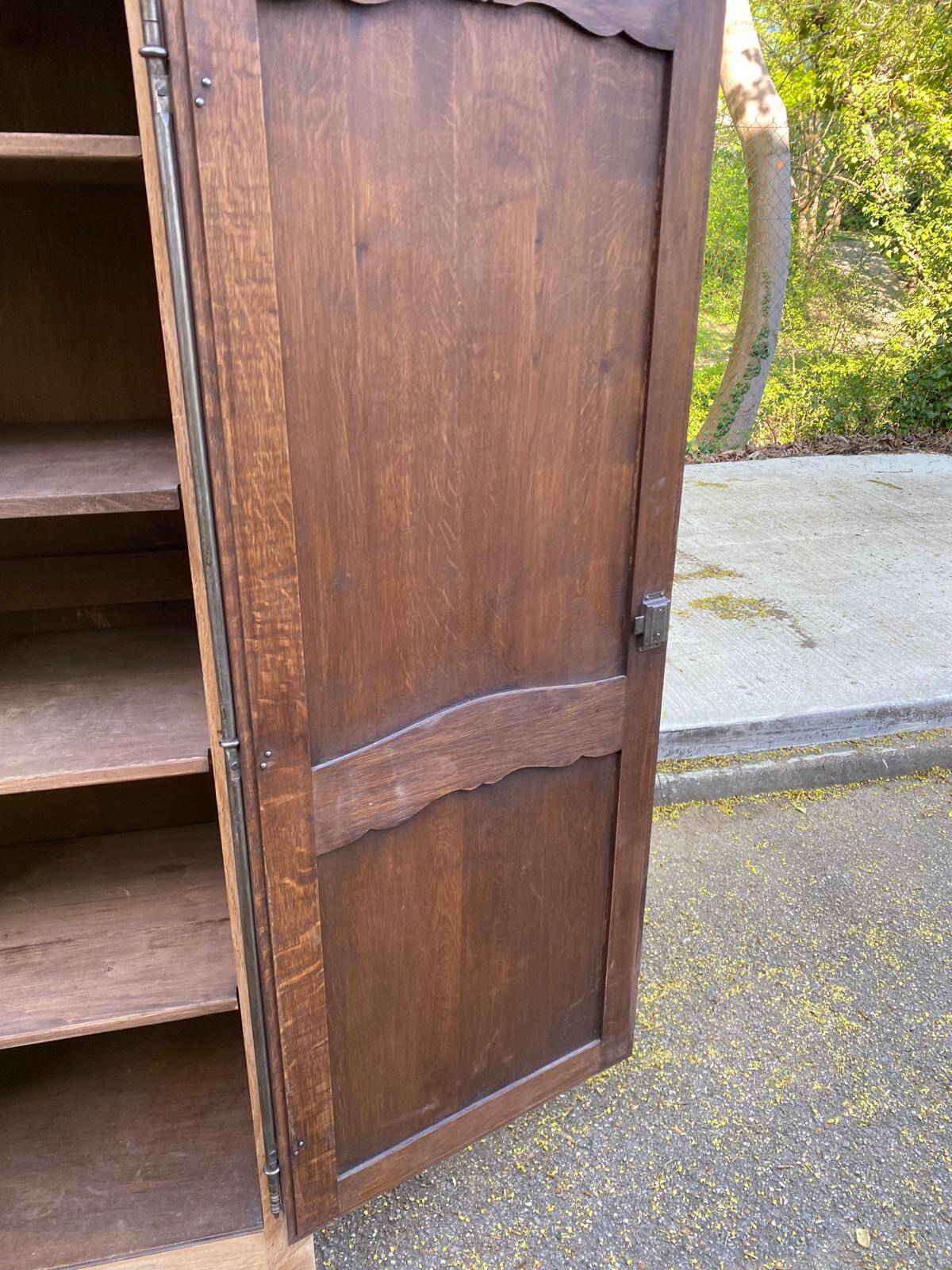 Renovated Louis XV bonnetière dormitory wardrobe in solid oak.