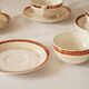 Set of 4 white, red and gold porcelain teacups, Ceranord