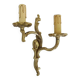 Antique double wall sconce in bronze, acanthus leaf design.
