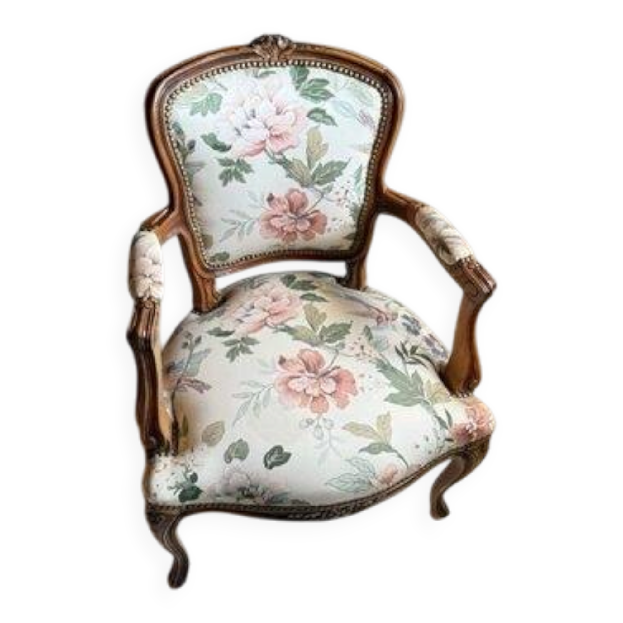 Louis XV style armchair upholstered in floral fabric.