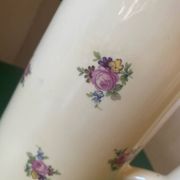 Old flowery and gilded pitcher.
