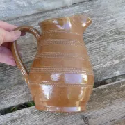 Old stoneware wine jug with patterns