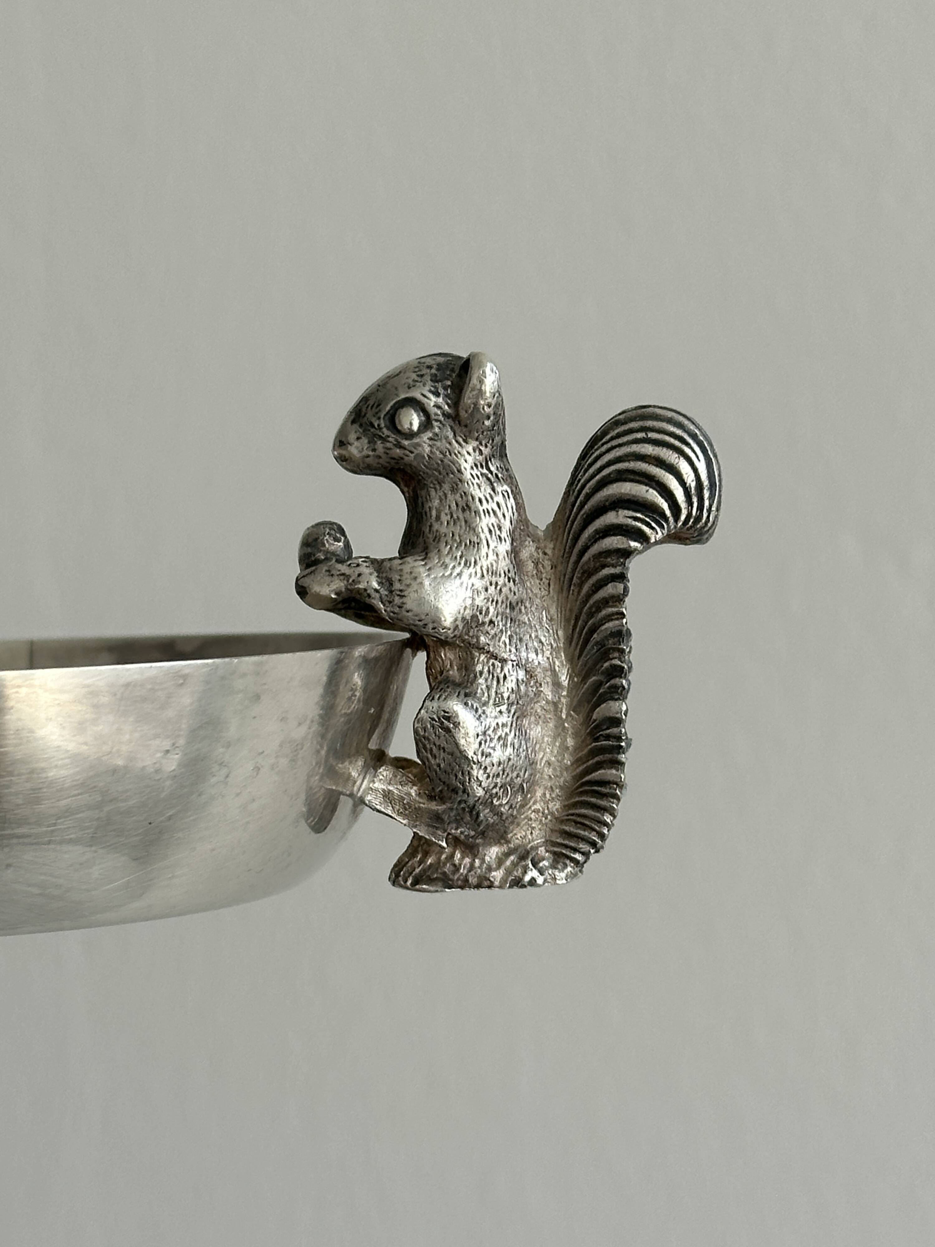 Metal cup with squirrel