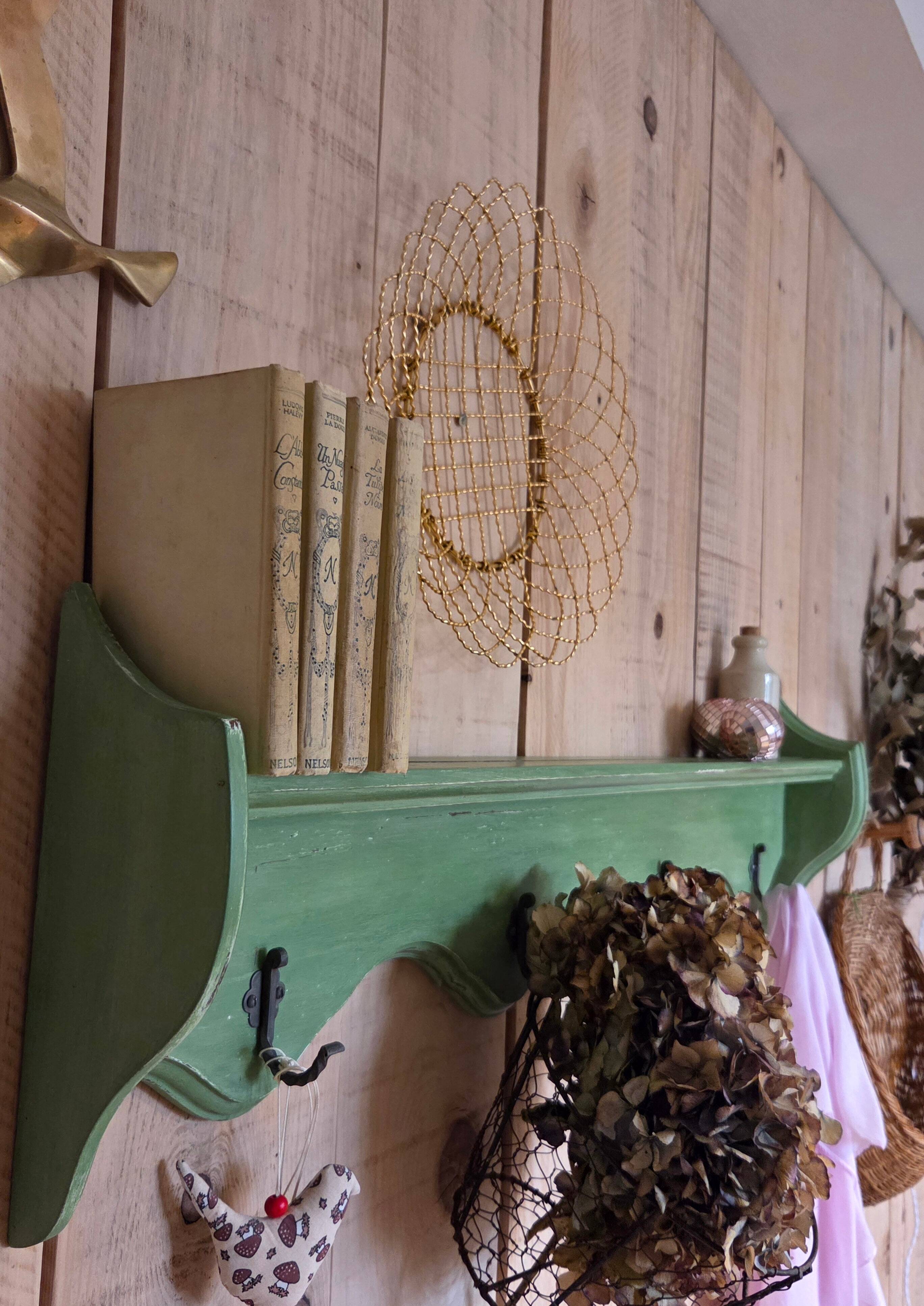 Antique wall shelf with a green patina