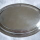 Oval plate in silver metal