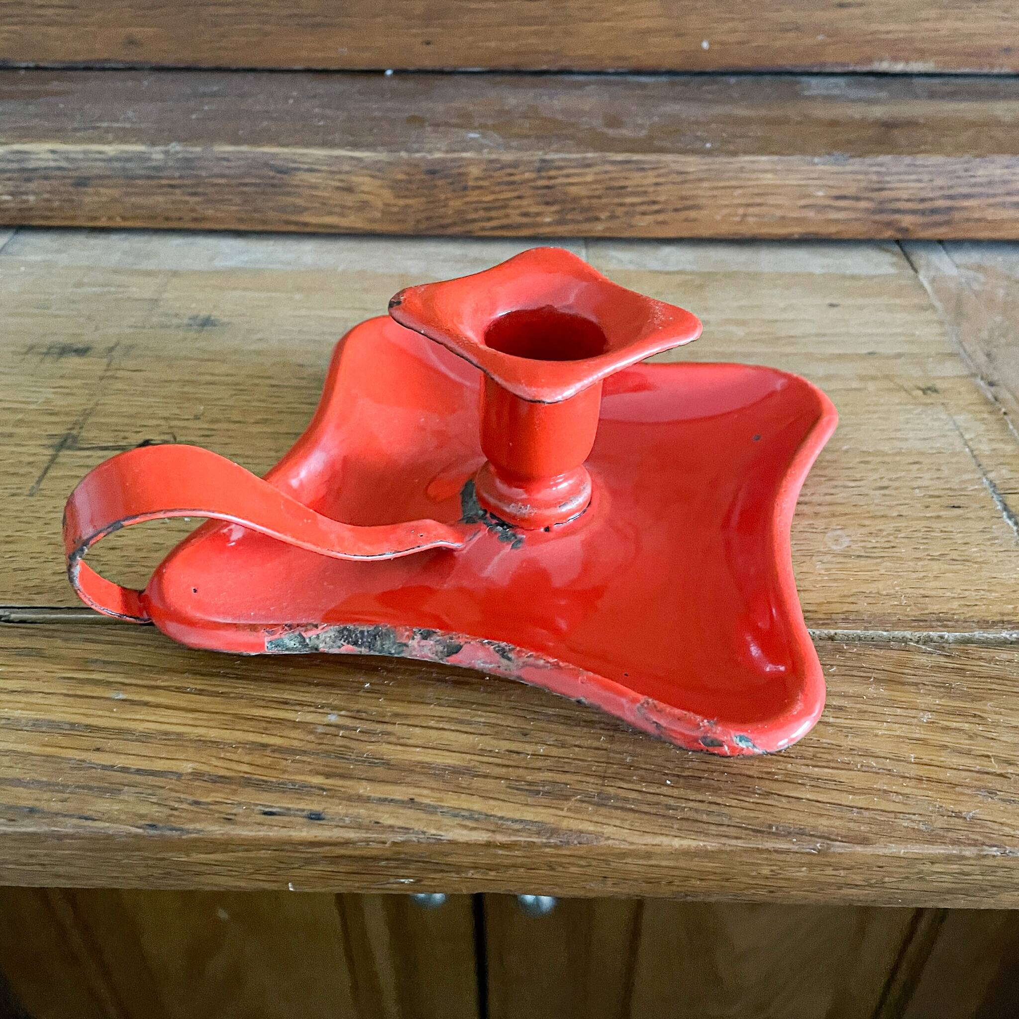 Red enamelled sheet metal candle holder