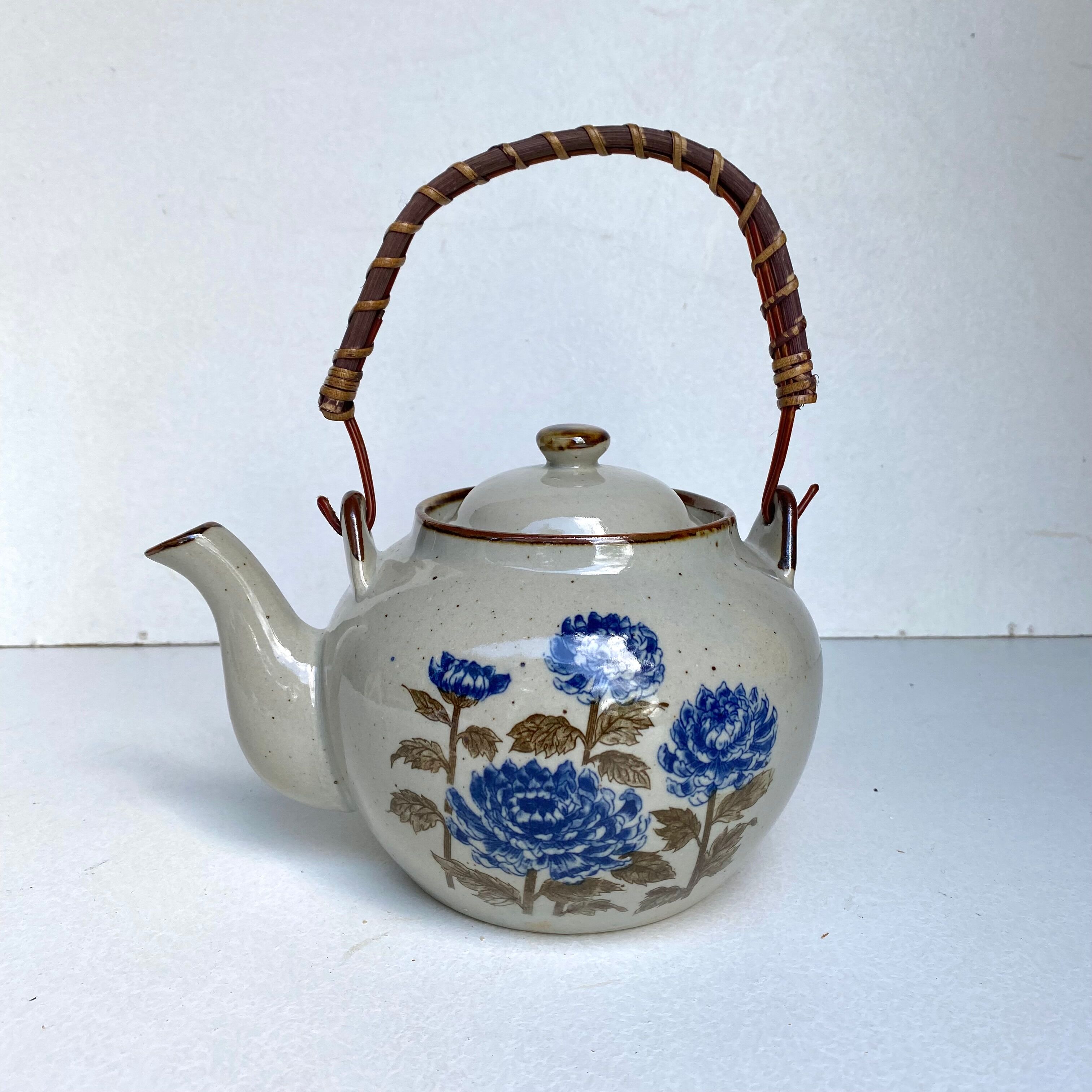 Vintage sandstone teapot wicker handle