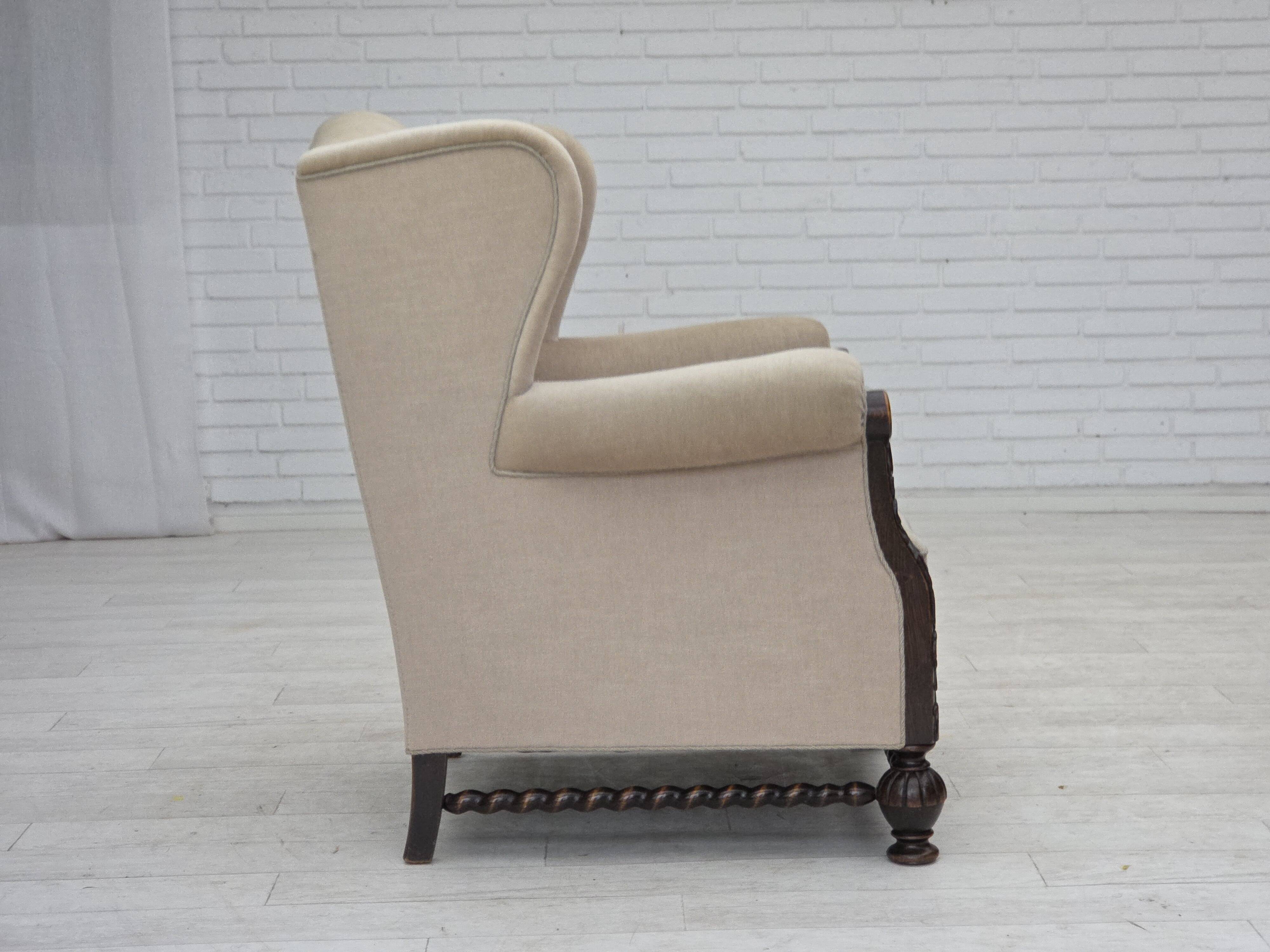 1960s, Danish wingback armchair, furniture velour, carved oak wood.