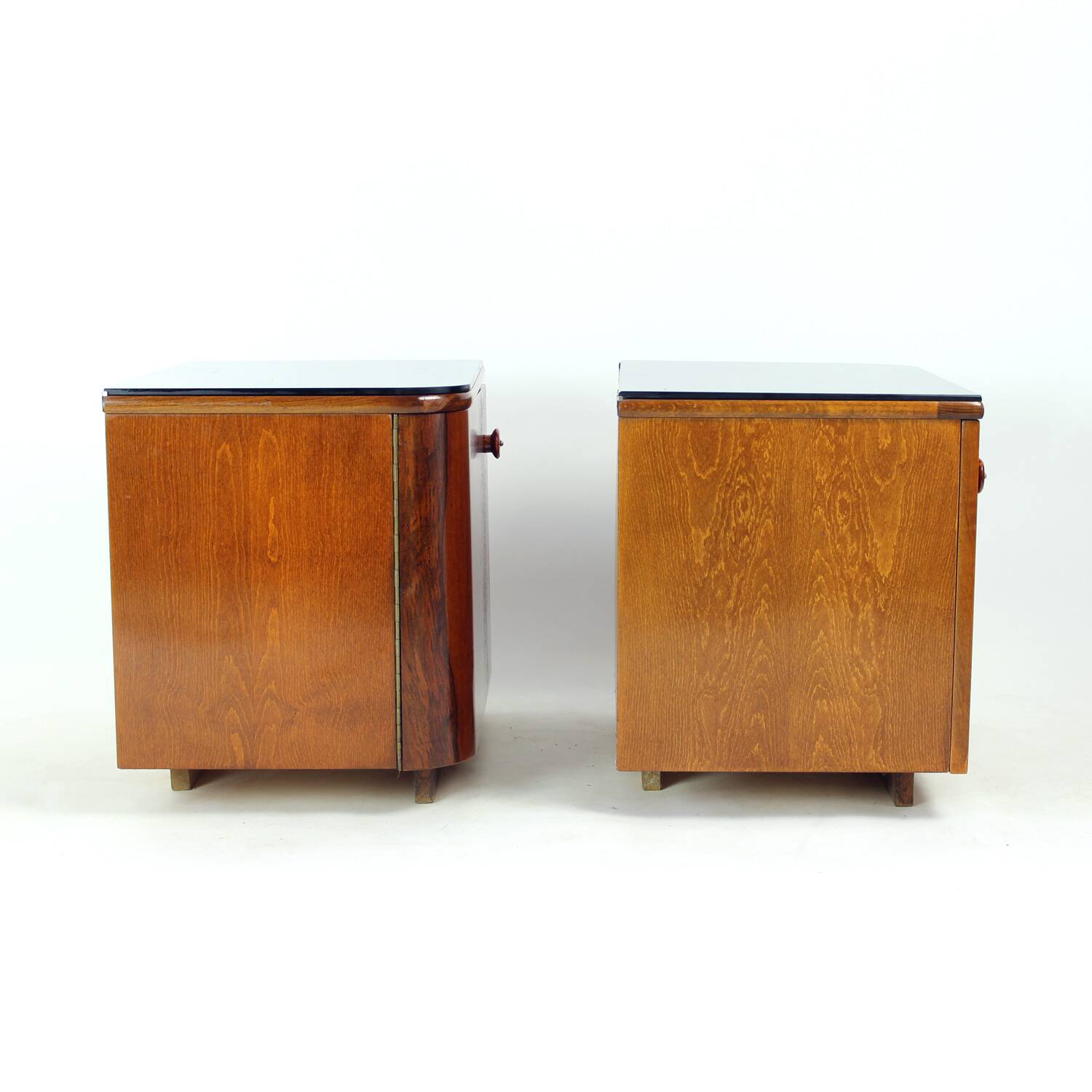 Pair of Art Deco bedside tables in walnut and black glass, Czechoslovakia.