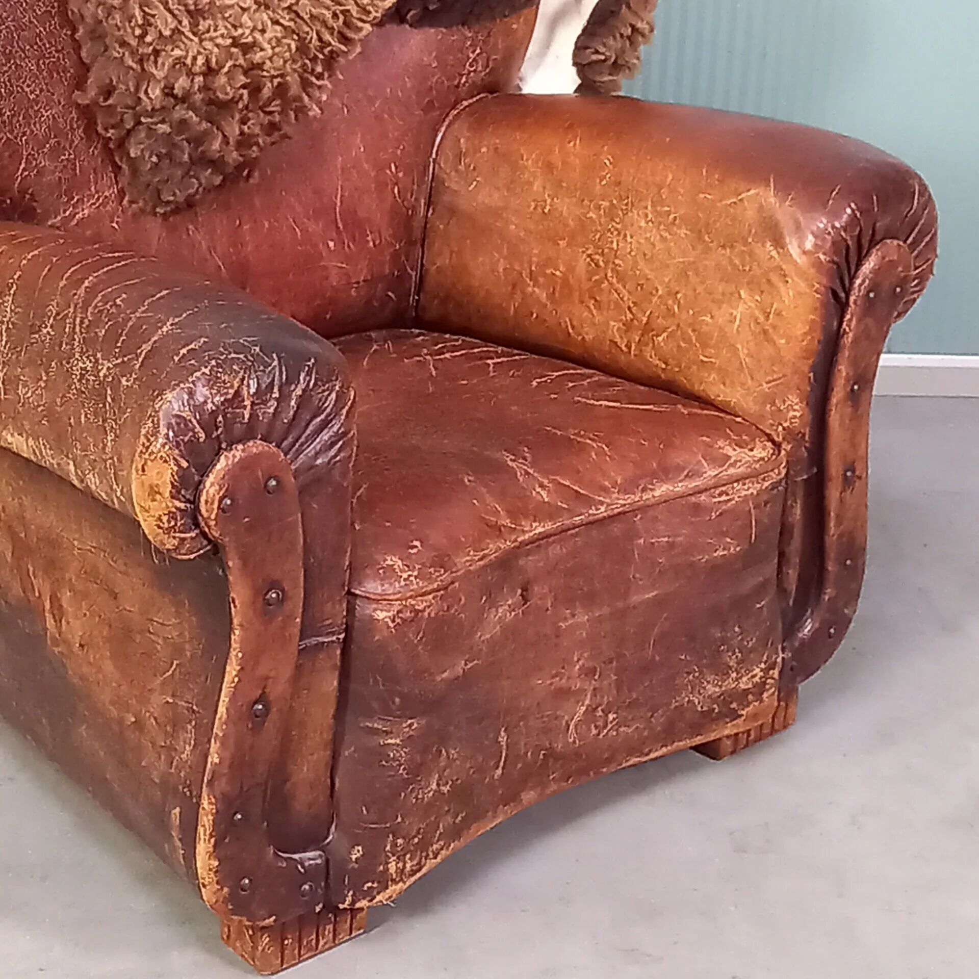 Leather nailed armchair