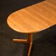 Oval dining table with 2 extensions.